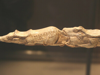 This carving of swimming reindeer is one of the most beautiful pieces of Ice Age art ever discovered. It is a carved from the tip of a mammoth tusk and is around 13,000 years old. This places it at the end of the Last Ice Age, when animals such as mammoths, reindeer and wolverines roamed Europe, British Museum, UK