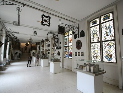 An interior view of the Musée Carnavalet, Paris, showcasing its historic architecture and refined atmosphere, France