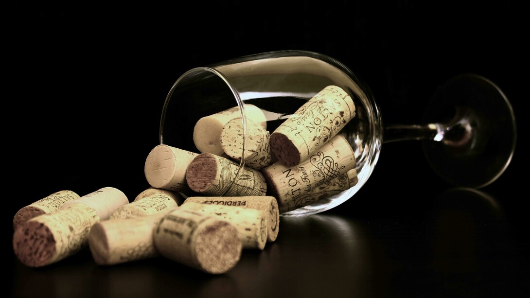 Brown wine corks gathered inside a clear glass