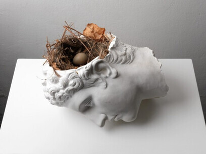 Senza titolo, 2009 book, plaster cast, clock 54 x 41 x 32 cm Claudio Parmiggiani masterfully combines the enduring legacy of classical art with the fragile simplicity of nature, inviting reflection on time, vulnerability, and the ongoing flow of life. Image courtesy of the Artist/Estorick Collection of Modern Italian Art