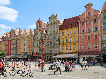 Historic Market Square with colorful townhouses shining in the morning light, Wrocław, Poland
