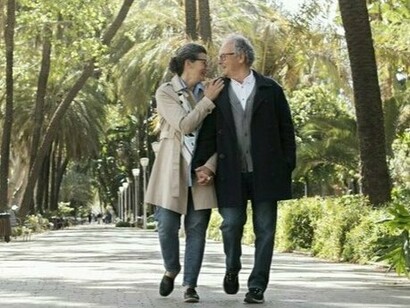 Strolling through a leafy park, this couple reaps the benefits of movement and fresh air that support heart and respiratory health