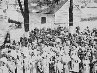 Every face in this photograph bears witness to endurance—the strength to live, love, and hope in a world that refused their freedom