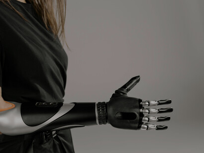 Wearing a bionic arm, the woman represents the intersection of innovation and empowerment in disability tech