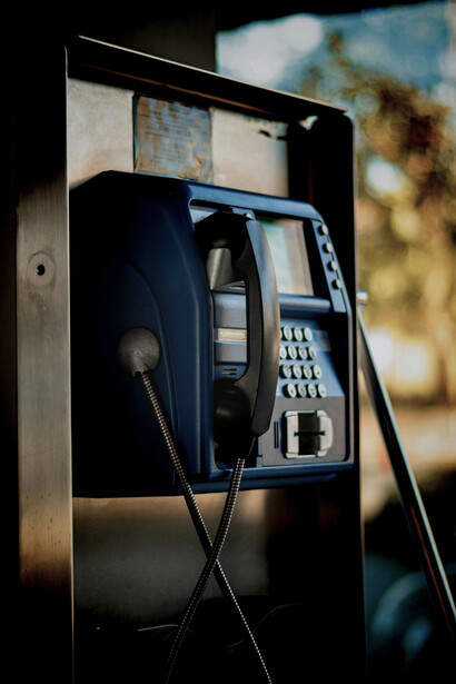 Interior of an old public telephone booth evoking immigrant nostalgia