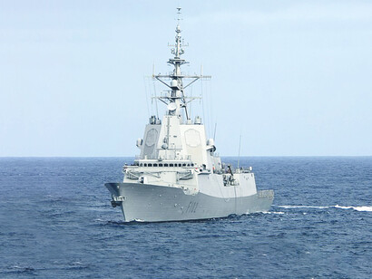 A rigid-hull inflatable boat returns to the Spanish Navy frigate ESPS Almirante Juan de Borbón (F 102) following a personnel transfer. The Almirante Juan de Borbón is actively participating alongside the George H.W. Bush Carrier Strike Group in the British-led exercise Saxon Warrior 11