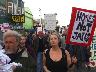 Protesters fill the streets with signs reading 'Housing is a right,' calling attention to the growing crisis of affordability and displacement
