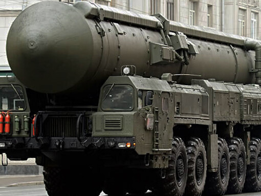 Russian troops positioned beside the Yars strategic missile system, which is capable of carrying nuclear warheads
