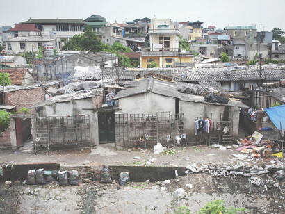 An urban slum in Hanoi, Viet Nam. According to the World Bank, over 13 percent of Viet Nam’s population, and a quarter of the world population – nearly 2 billion people – live on $1.25 or less a day
