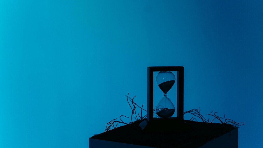 In silence, the hourglass measures the unseen: every falling grain is a moment slipping from present into memory