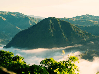 Fog covering the mountains at dusk, representing the natural landscape and evening calm of Davao, Philippines