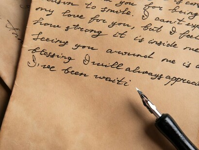 A close-up of handwriting on aged paper, capturing the flow of thought in each stroke