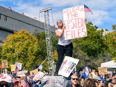 A protest on October 2025, with a protester holding a sign asking for the Epstein Files to be released