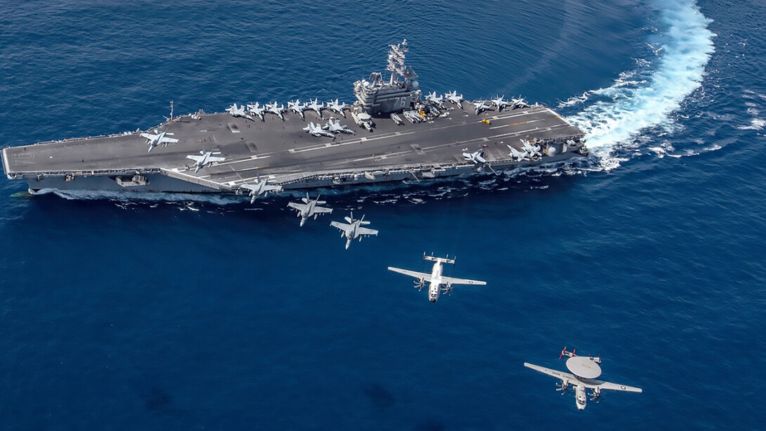 South China Sea (Oct. 9, 2019), Aircraft from Carrier Air Wing (CVW) 5 fly in formation over the forward-deployed aircraft carrier USS Ronald Reagan (CVN 76), flagship of Carrier Strike Group 5