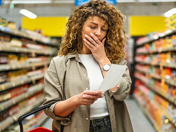 Woman concerned about the rising prices of groceries