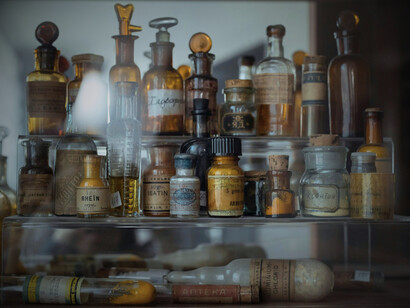 A slew of herbal medicines sitting on a shelf, representing natural remedies, can be useful for various ailments and conditions, providing an alternative to pharmaceutical options