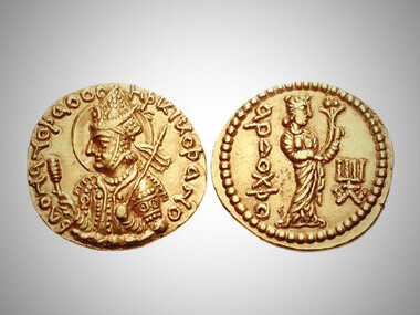 Coin of the Kushan king Huvishka, who ruled during the 2nd century CE, known for promoting religious and cultural syncretism across his empire. This particular coin features Greco-Roman script and depictions of Indian and Iranian deities, reflecting the diverse influences that shaped Kushan art and politics
