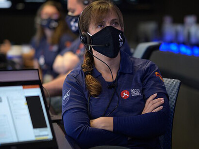 NASA's Curiosity rover, part of the Mars Science Laboratory, is designed to explore Mars' potential for microbial life. In this image, the rover examines a rock with tools on its 2-meter (7-foot) arm, during tests before its fall 2011 launch