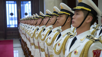 Chinese sailors stand in formation ahead of a visit by Chief of Naval Operations (CNO) Admiral John Richardson to the People's Liberation Army Navy (PLA(N)) headquarters in Beijing on January 14, 2019, China