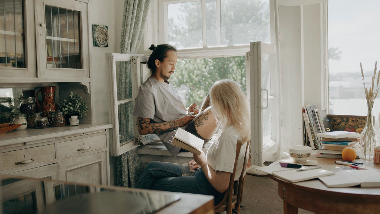 Embracing the simplicity of an unplugged day, the two find solace in shared moments of quietude and literary exploration