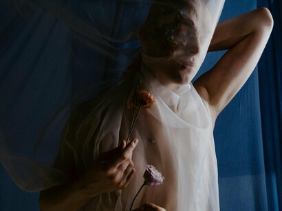 A veil swallowing a person, representing how powerful and consuming grief and PTSD can be