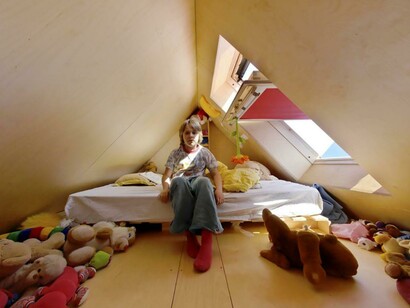Spiral staircases lead to the rooftop units of Didden Village in Rotterdam, Netherlands, creating a unique connection between privacy and communal life
