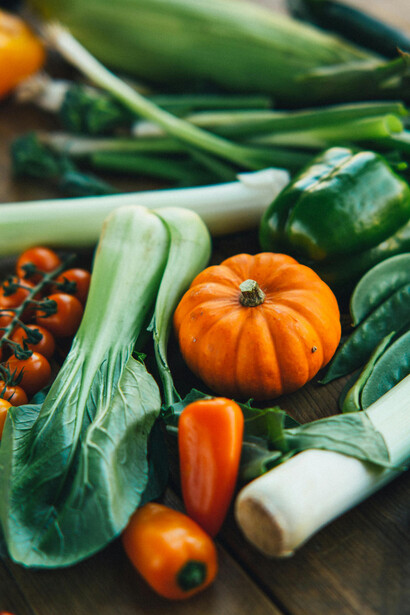 Fresh vegetables on a wooden table — healthy and Paleo-inspired