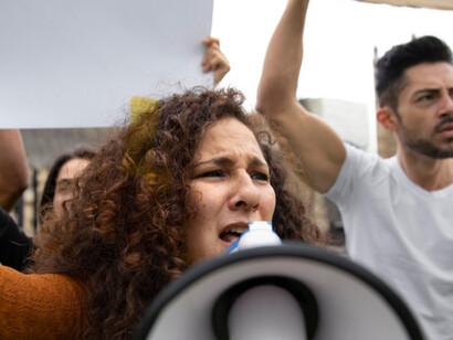 A young protester shows anger and urgency that fuels change