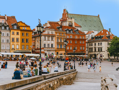 Vibrant pastel façades of the Old Town glowing beneath a bright blue sky, Wrocław, Poland