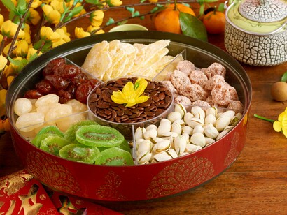 Bánh chưng, tea, fruit, and red envelopes — symbols of gratitude, continuity, and renewal during Tet