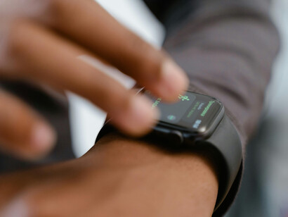 Close-up shot of a person checking notifications on a smartwatch