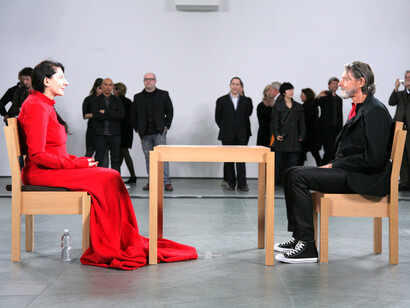 The performance piece The Artist Is Present featured Marina Abramović sitting silently at a table in MoMA from March 14 to May 31, 2010, inviting visitors to sit across from her for an intense, shared moment of connection, USA