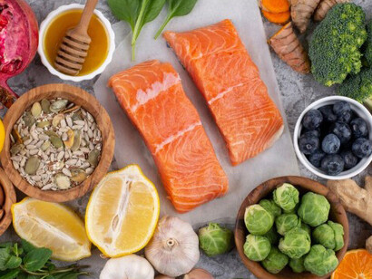 A display of immunity-boosting superfoods featuring fresh vegetables and fish