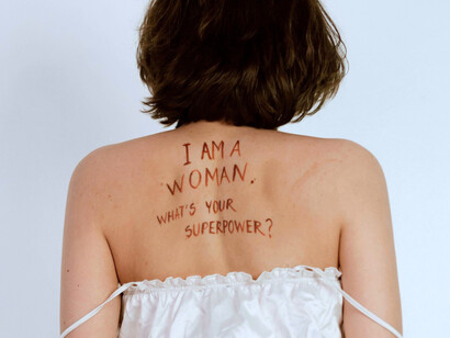 A woman proudly owning her superpower, highlighting why inclusion is essential for global growth