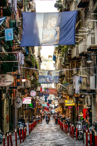 Lanterns and flags brighten the old town streets of Napoli, Campania, Italy