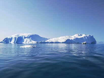 Floating between permanence and disappearance, the iceberg reflects the quiet urgency of global warming