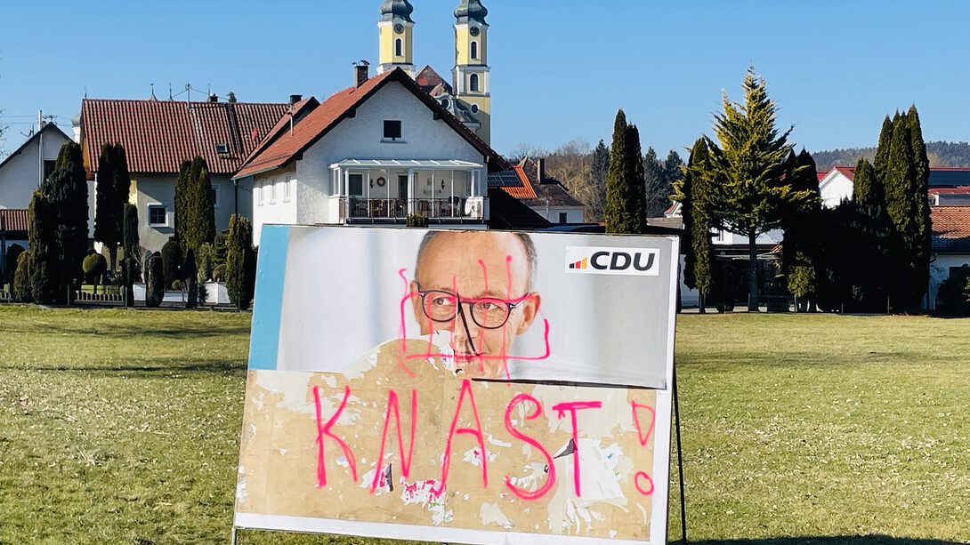 Friedrich Merz campaign poster vandalized in Rot an der Rot, Germany — 2025