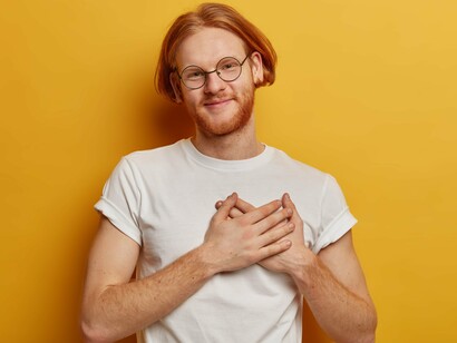 An everyday movement that reflects inward attention and emotional regulation