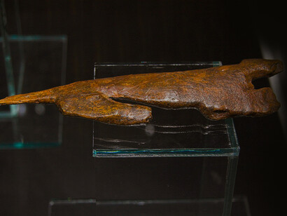 Statuette of a feline, probably lion. Mammoth ivory, length 21.5 cm. Original. Pavlov (Břeclav District, Czech Republic), Gravettian. Temporary exhibition the Mammoth hunters in the NM Prague