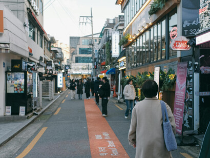 People walking along a busy street in Seoul, South Korea