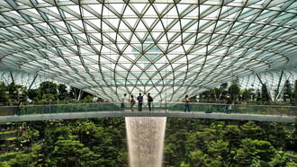 The lush interior of Jewel Changi Airport in Singapore, blending nature with modern architecture