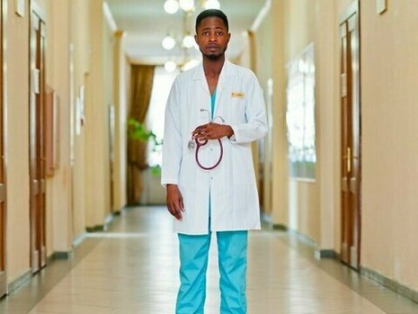 A doctor standing in the corridor, showing how the healthcare industry should thrive on the dedication and expertise of its professionals and provide quality care to patients