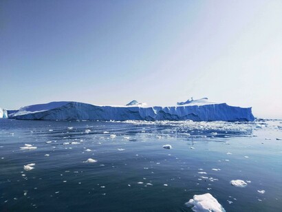 The iceberg illustrates the effects of rising global temperatures, as increased ocean heat accelerates ice melt