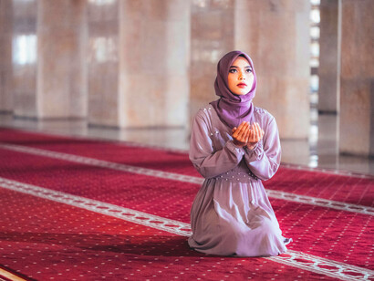 A young woman finds peace in prayer at a mosque in Jakarta, Indonesia
