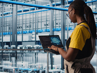 A smart factory engineer leverages AI automation and a tablet to streamline workflows and advance digital transformation