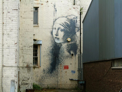 The Girl with the Pierced Eardrum, a Banksy graffiti artwork located in Bristol, United Kingdom
