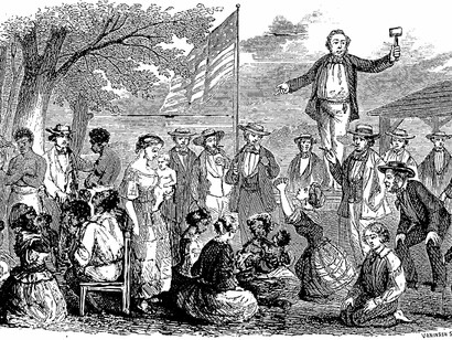 A slave auction, outdoors. The white auctioneer stands on a stage holding a gavel; a large American flag flies in the center of the picture