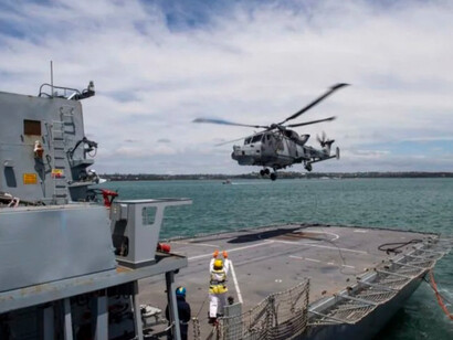 Troops from the U.S. Army’s 10th Mountain Division at Fort Drum, New York, stand assembled on the flight deck of the nuclear-powered aircraft carrier USS Dwight D. Eisenhower (CVN-69) as it heads toward the Caribbean to participate in Operations Able Vigil and Support Democracy off the coast of Haiti