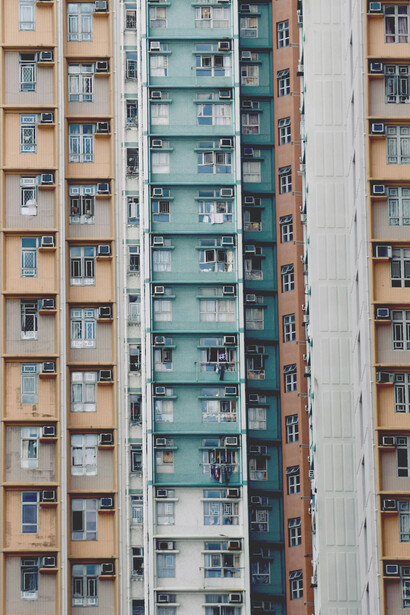 City apartments densely packed, revealing the growing economic disparity and housing crisis faced by many residents