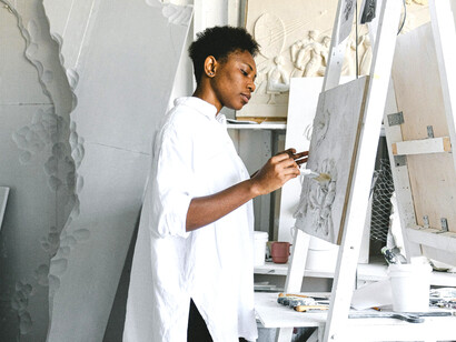 Amid the creative chaos of her studio, a woman artist finds peace in her personal sanctuary